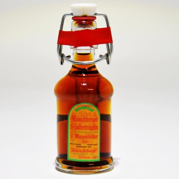 Kleine Bügelflasche Münchberger Klostertropfen Kräuterlikör mit rotem Bügelverschluss und gelbem Etikett